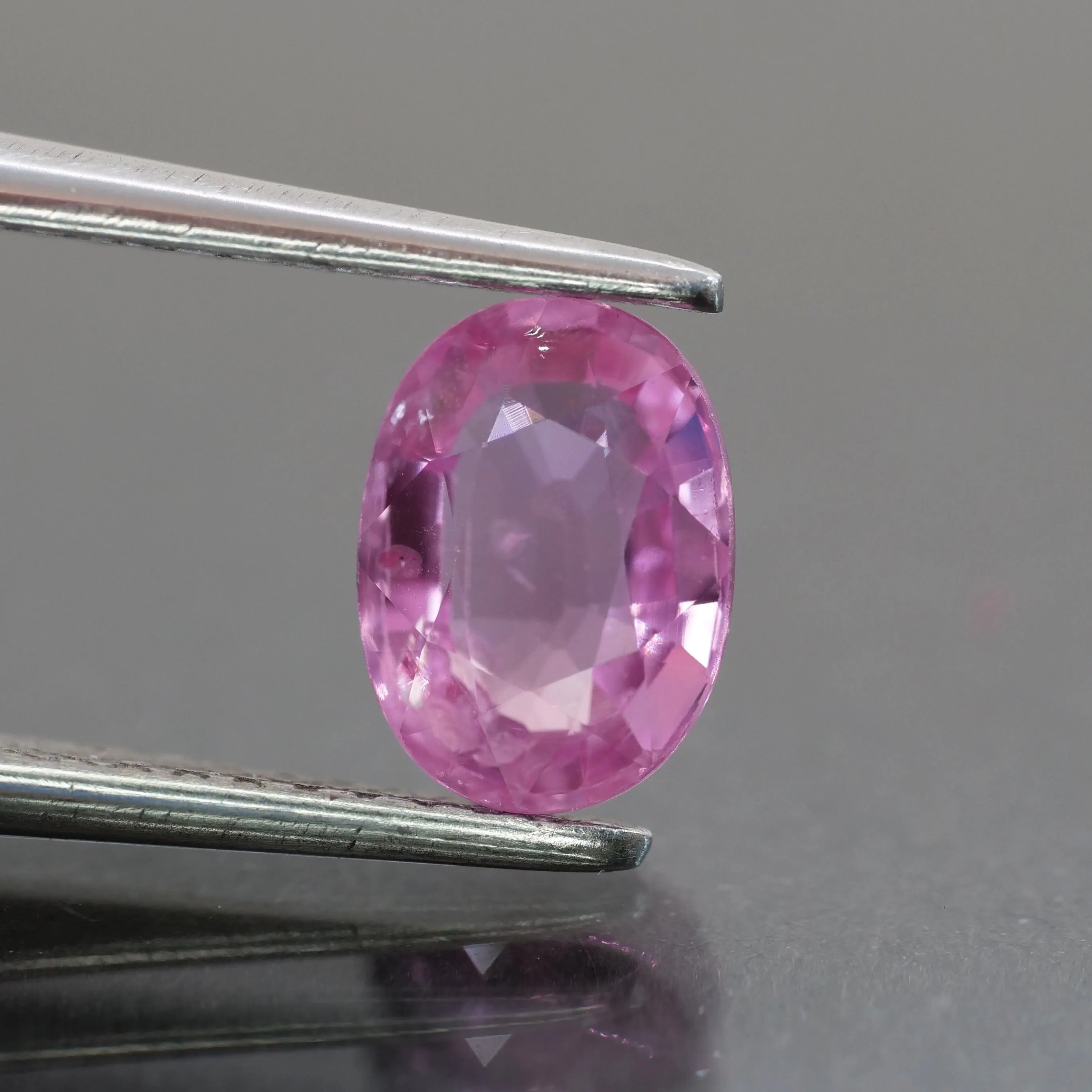 Sapphire | natural, pink, oval cut 7x5 mm, 1.08ct, Mozambique